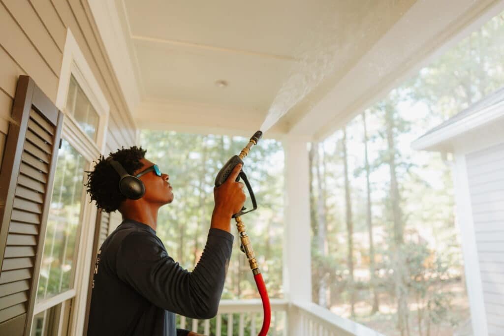 Soft washing mildew off the siding of a home near Athens, Georgia